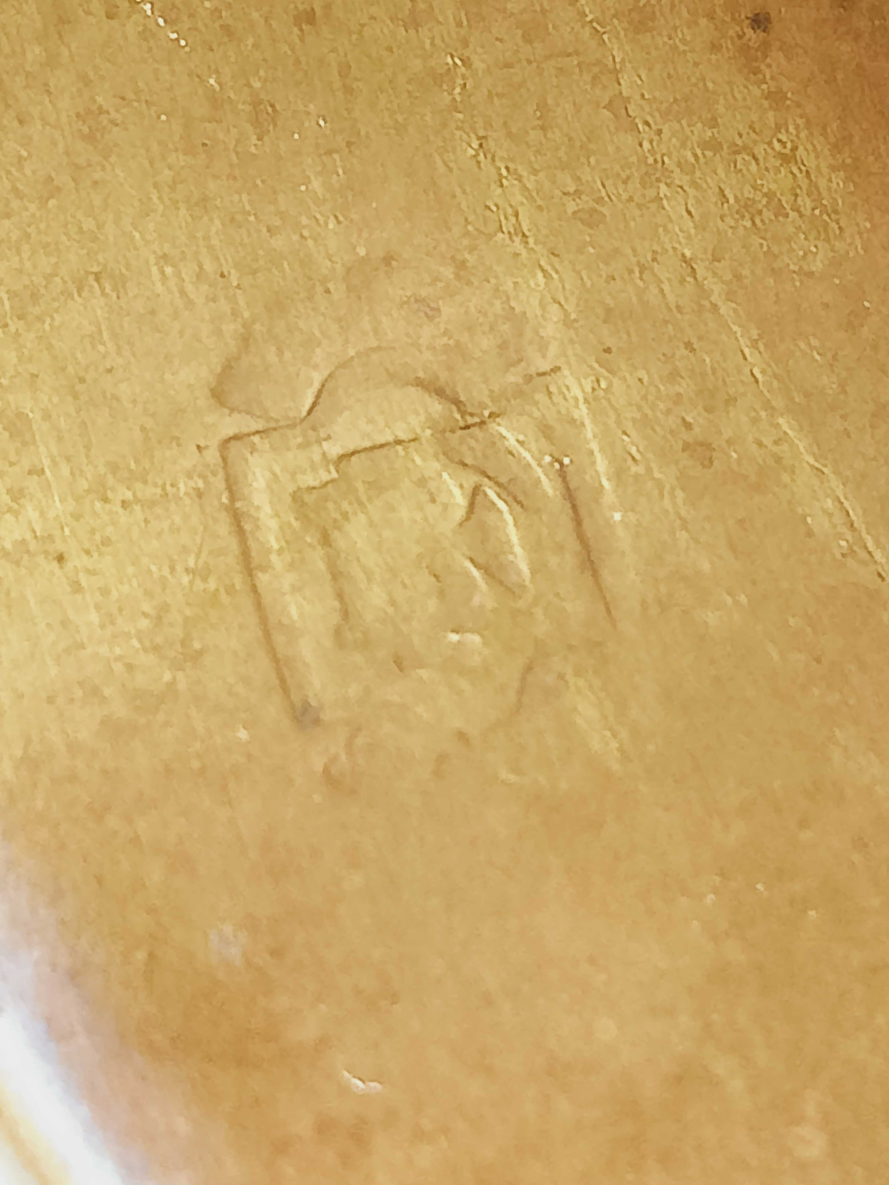 Old bronze or brass fireplace clamp