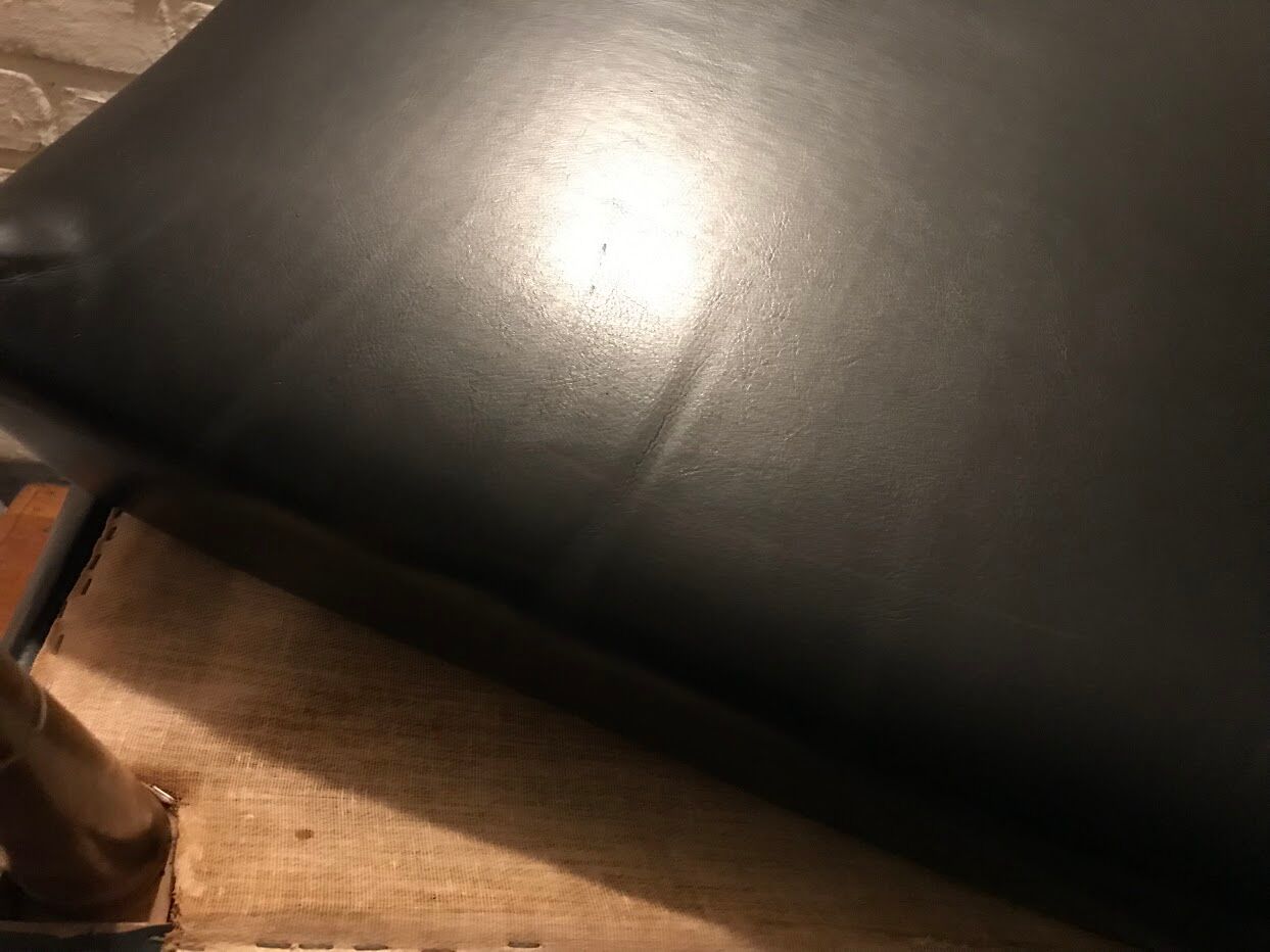 Vintage 60's armchair in black skai.