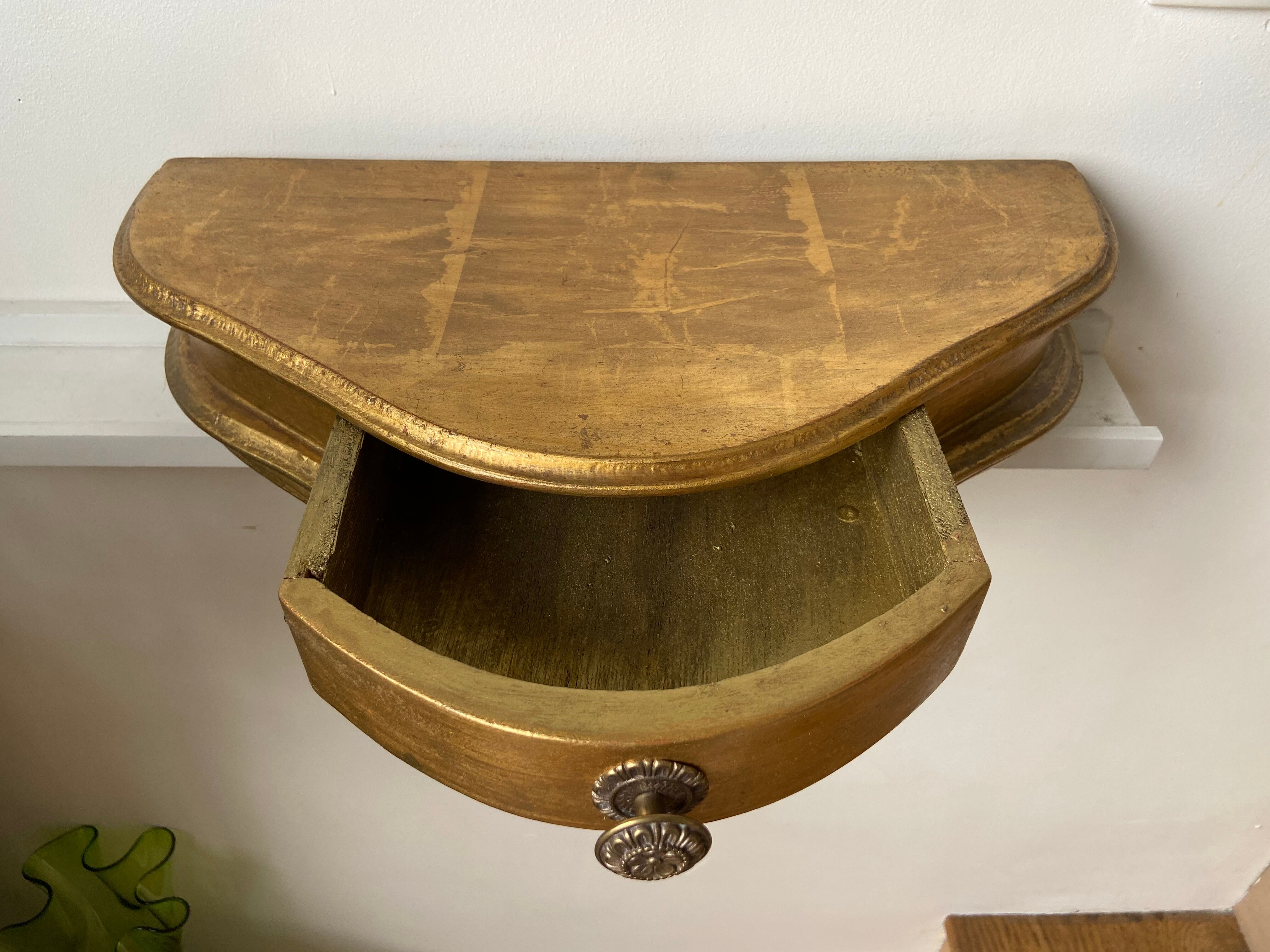 Gold wall shelf with drawer