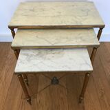 Pull-out tables in golden brass and marble