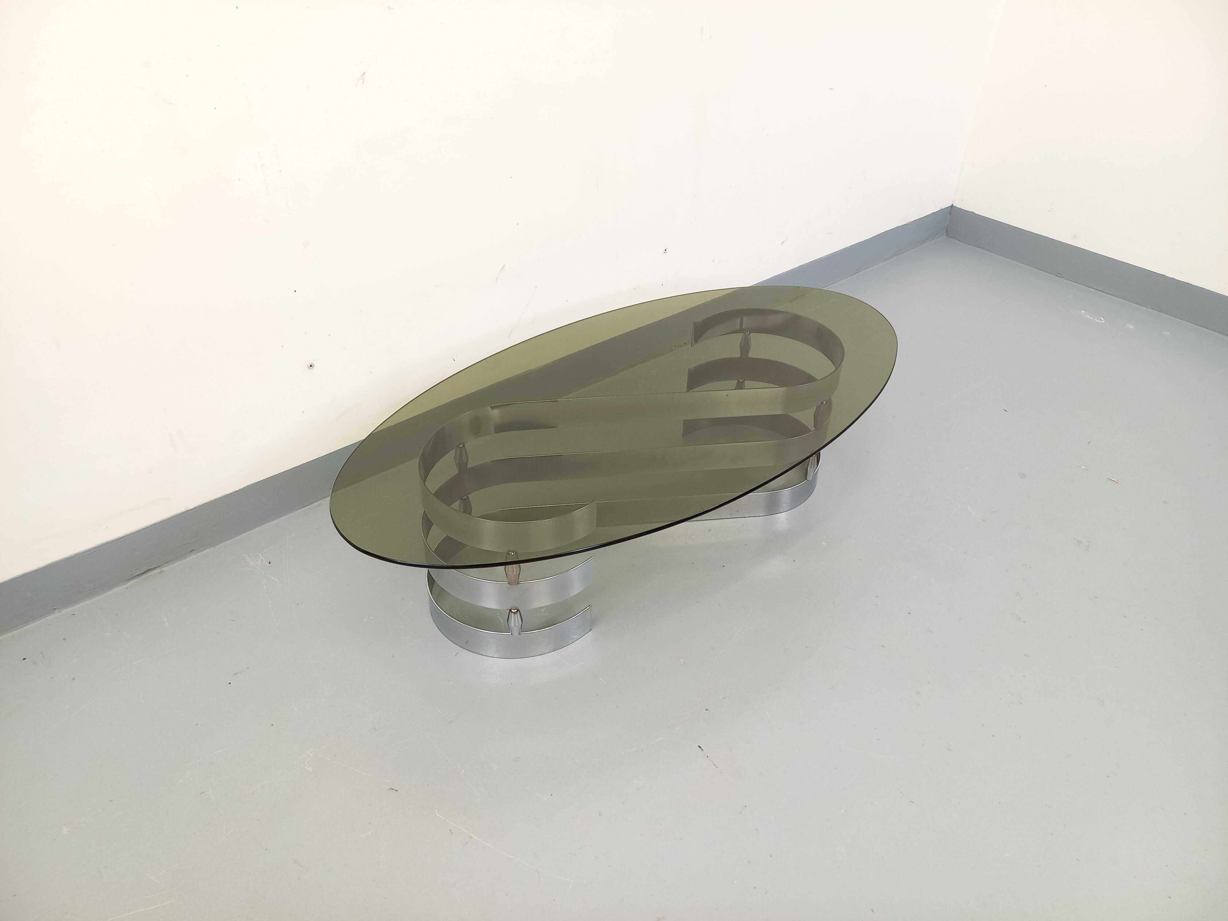 Vintage oval coffee table in smoked glass and chrome metal from the 1970s.