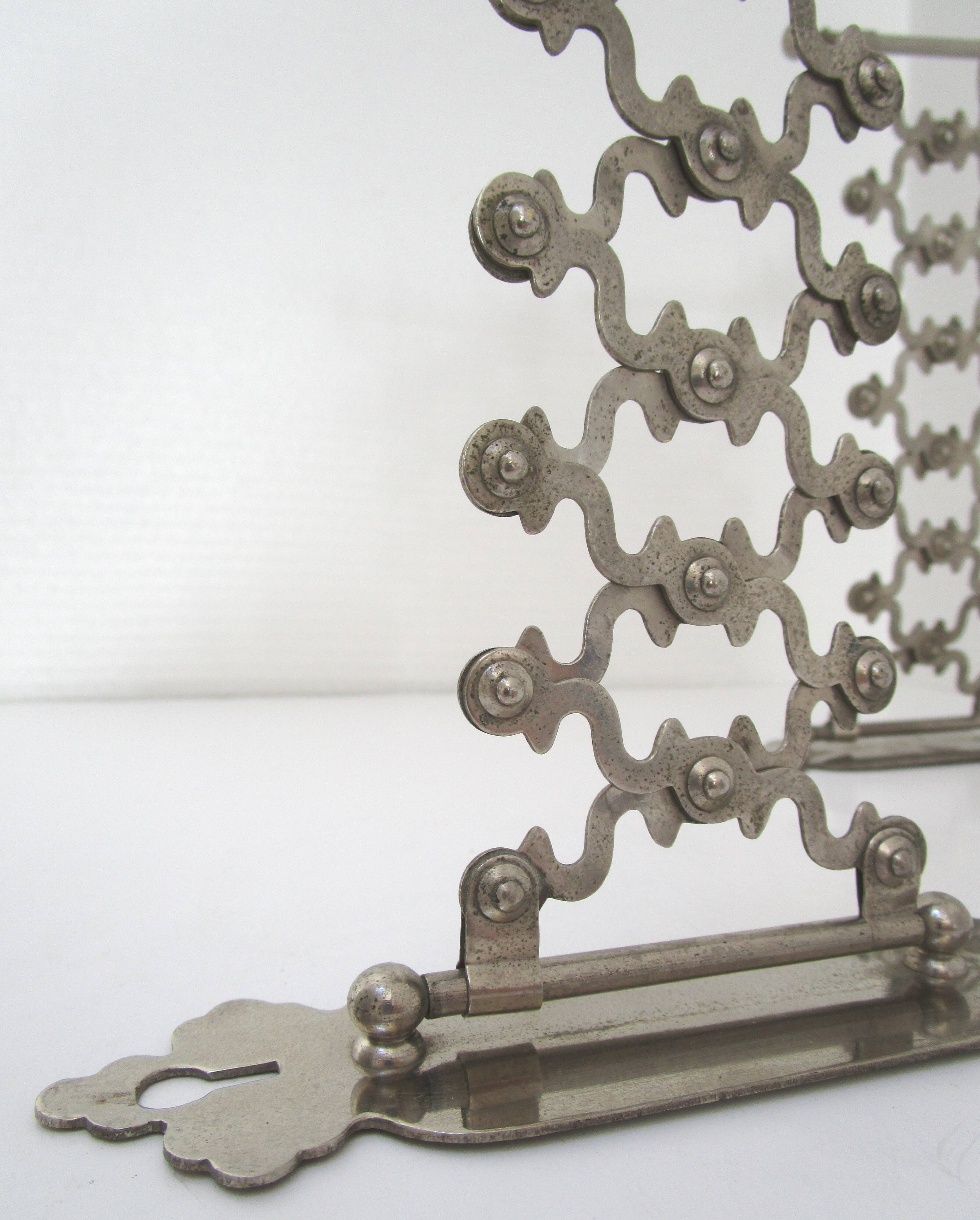 Pair of extendable old metal candlesticks