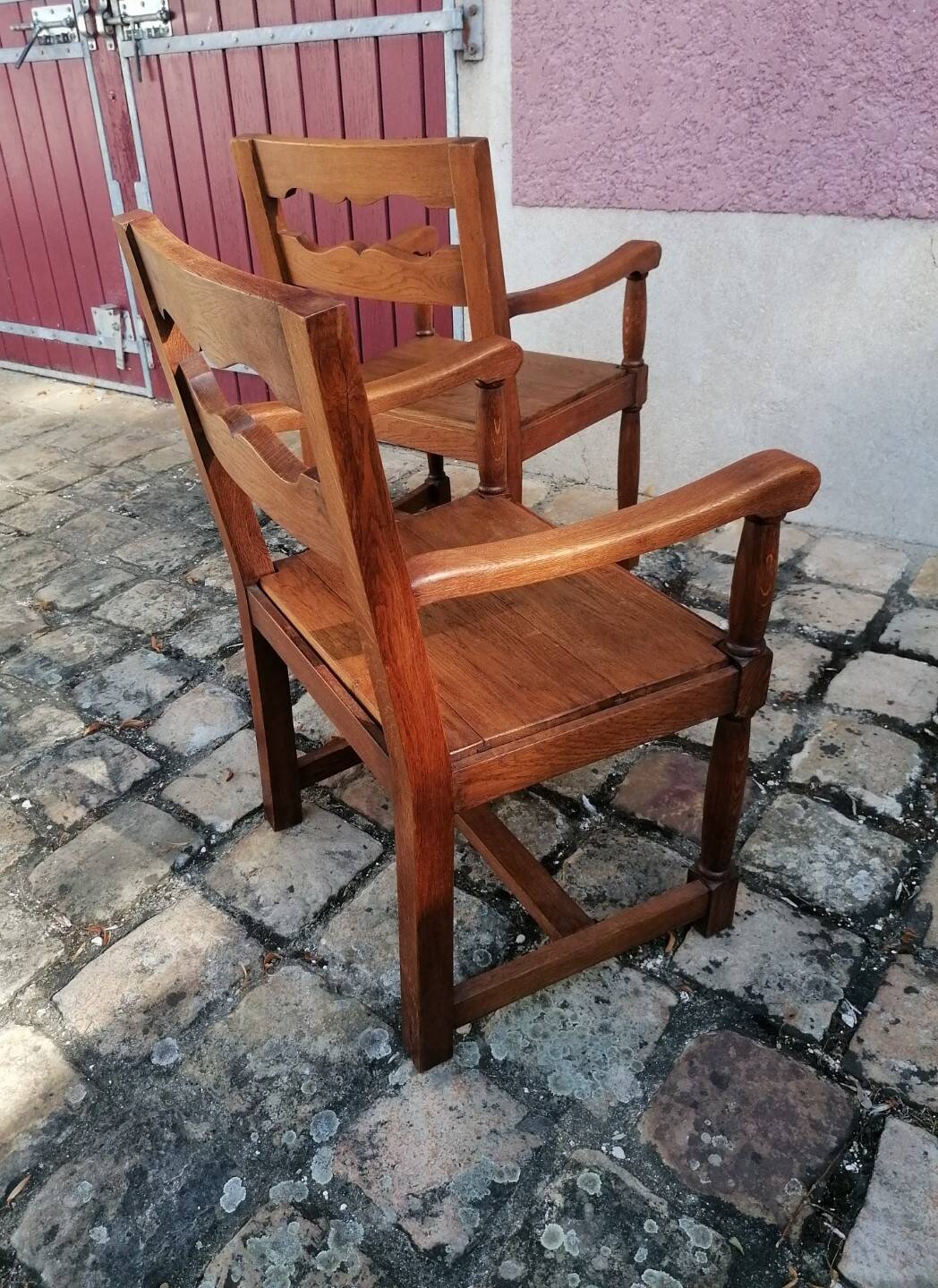 Pair of vintage oak armchairs with geometric design.