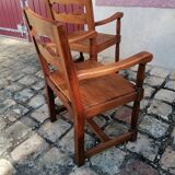 Pair of vintage oak armchairs with geometric design.