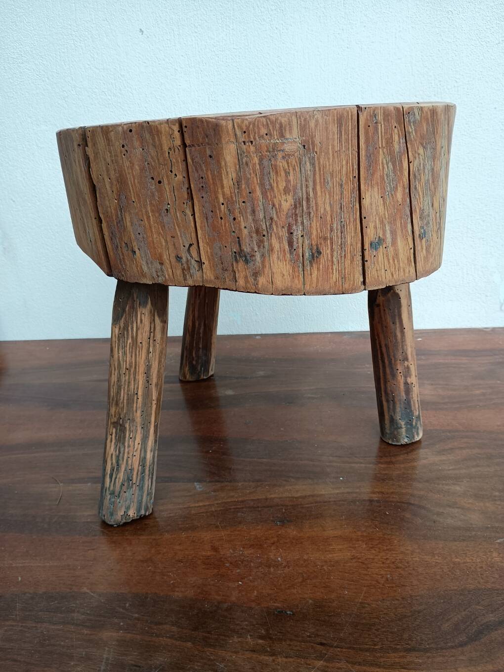 Brutalist tripod coffee table in solid wood.
