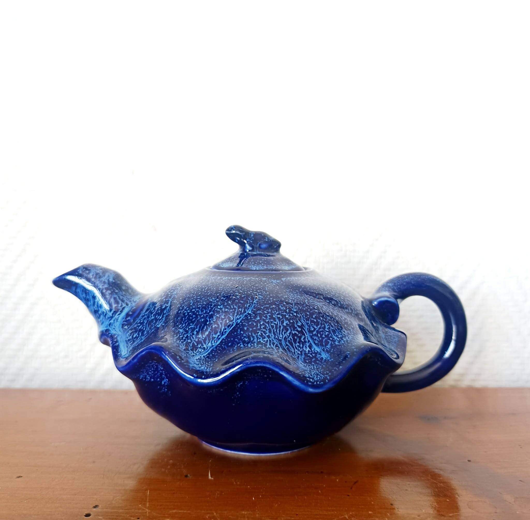 Blue ceramic Art Deco teapot with a frog.