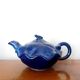 Blue ceramic Art Deco teapot with a frog.