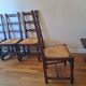 6 wooden and straw chairs