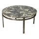 Round vintage coffee table with marble top and chrome base