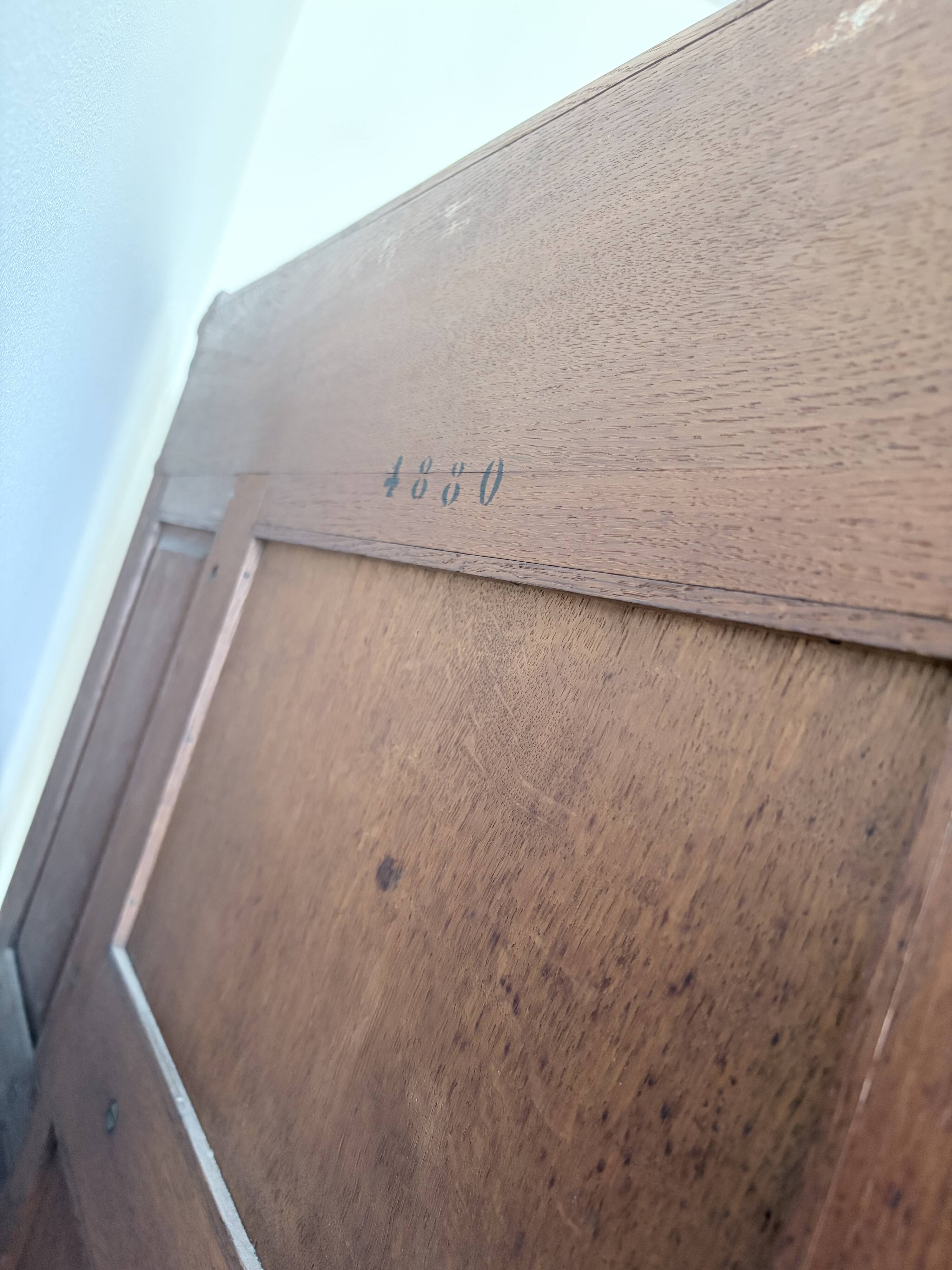 Large secretary with a drop-down front in carved oak, neo-Renaissance style.