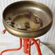 Red & gold metal tripod plant holder