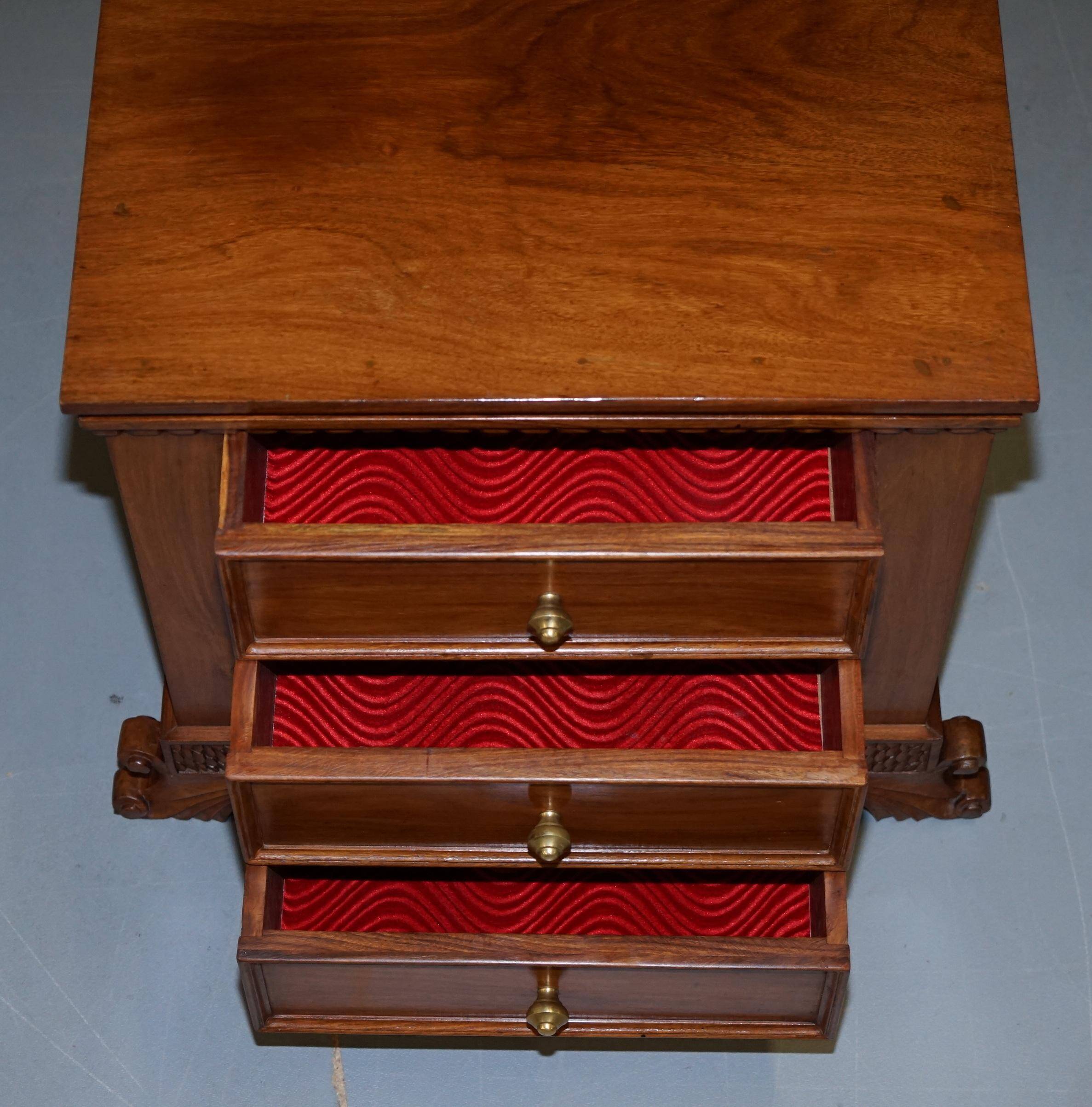 Set of hardwood dressers with finely carved bases.