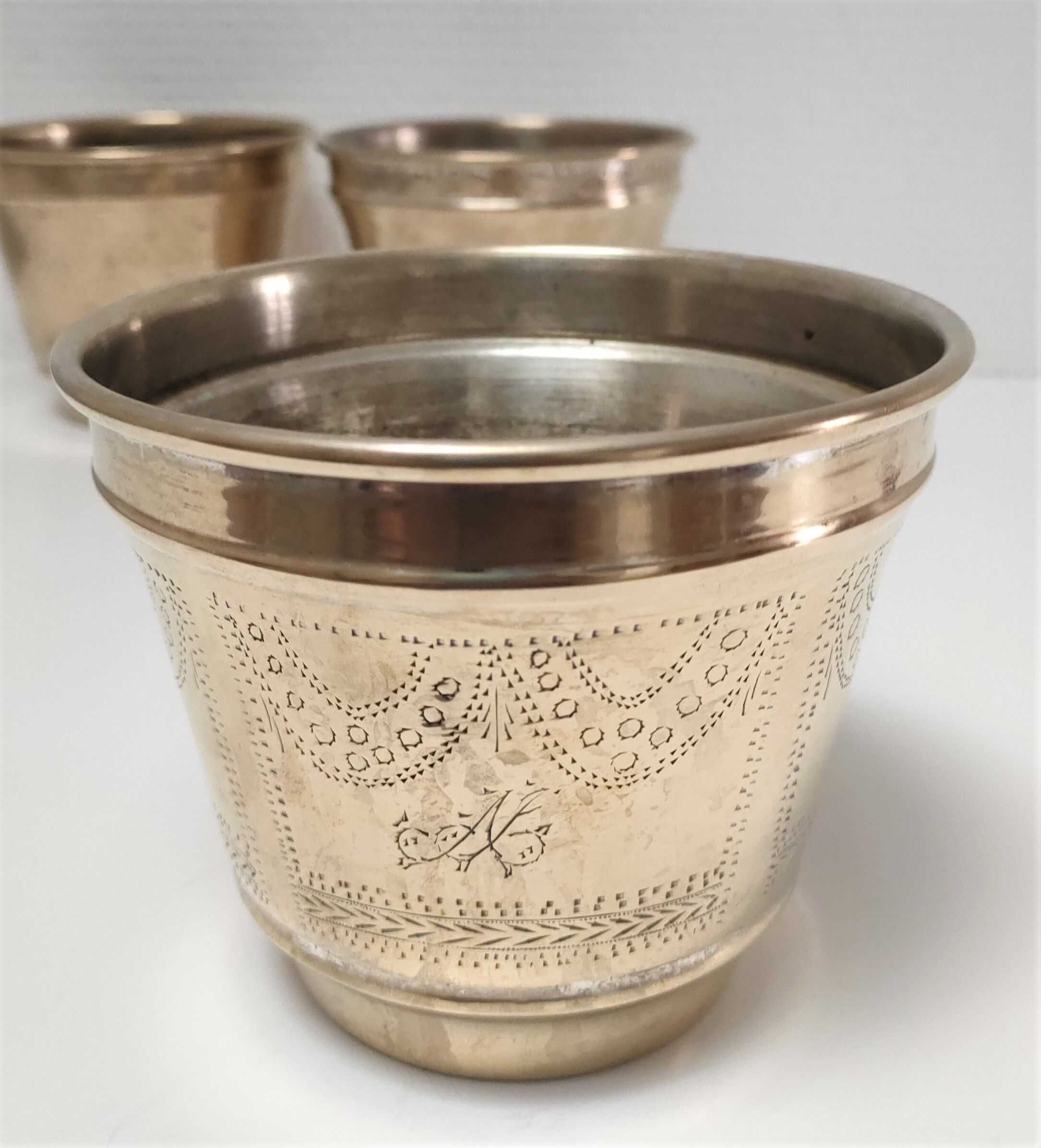 Three pot covers brass silver cover golden patina monogram early twentieth century