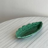 Green earthenware dish in the shape of a leaf