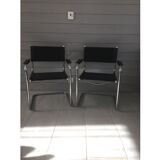 Pair of chrome/black hanging chassis chairs