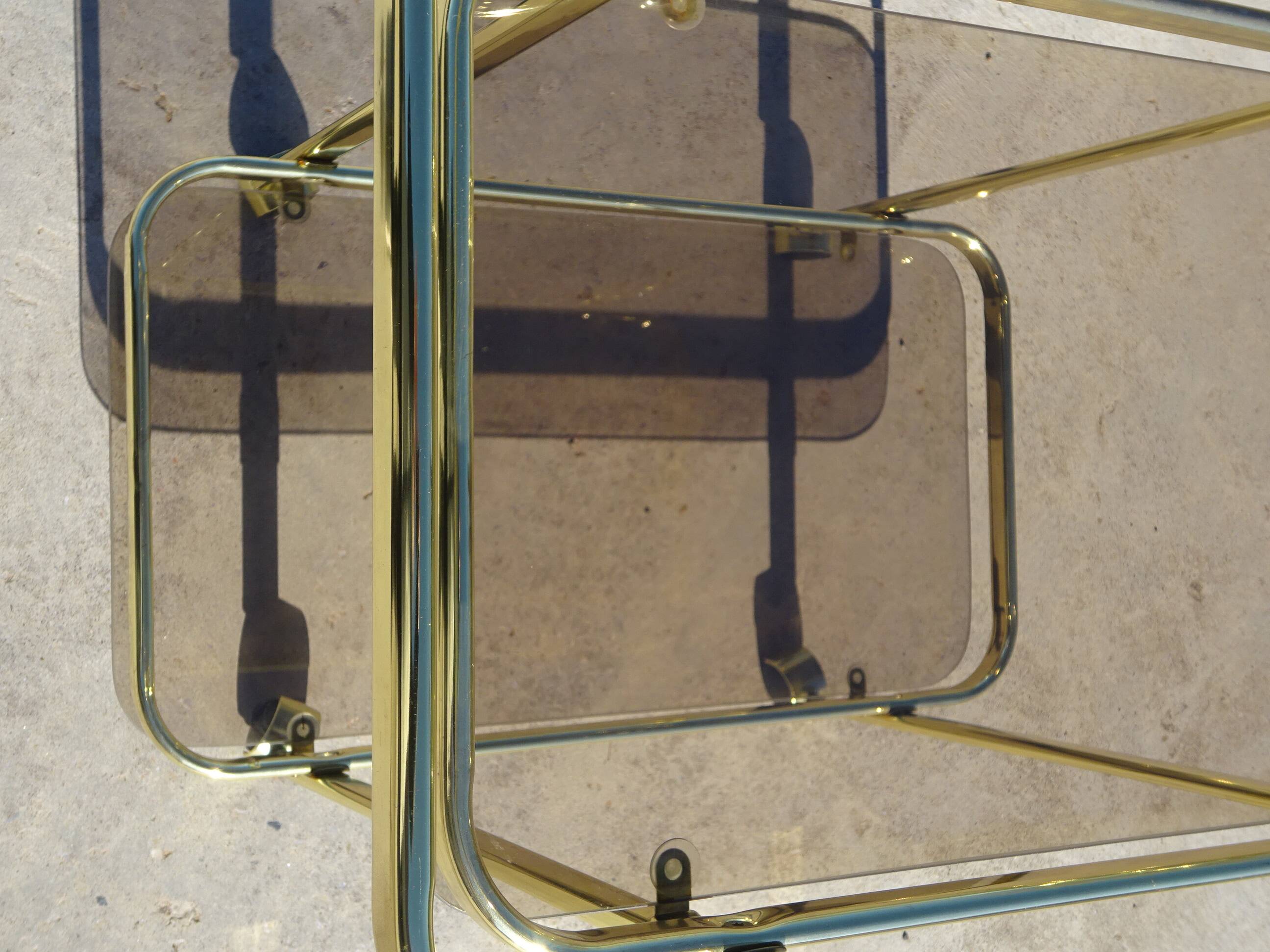 Golden metal and smoked glass dessert table