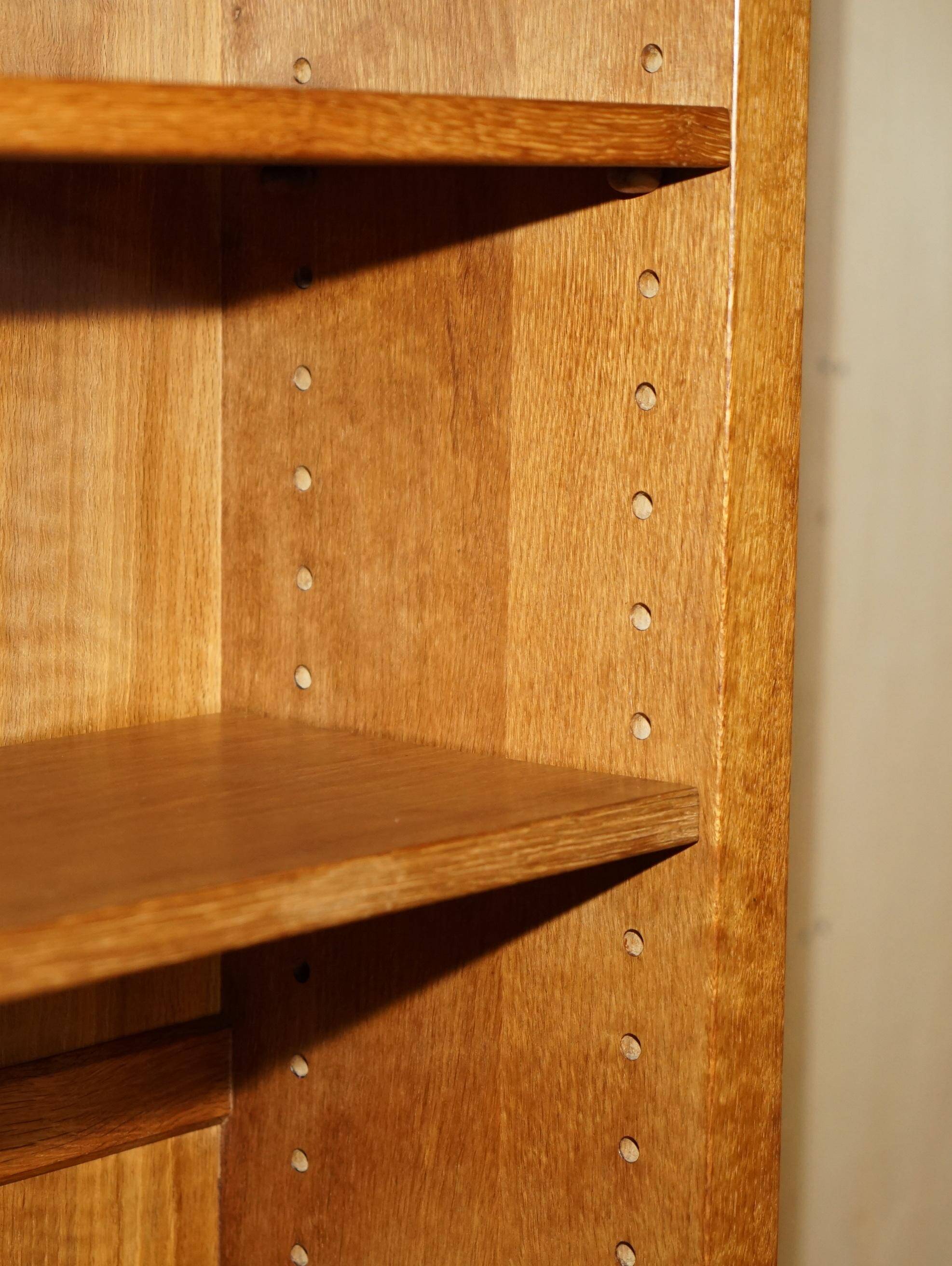 Pair of Robert Mouseman Thompson oak carved bookshelves.