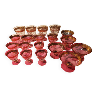 1930s footed glass service with gilding, including champagne flutes.