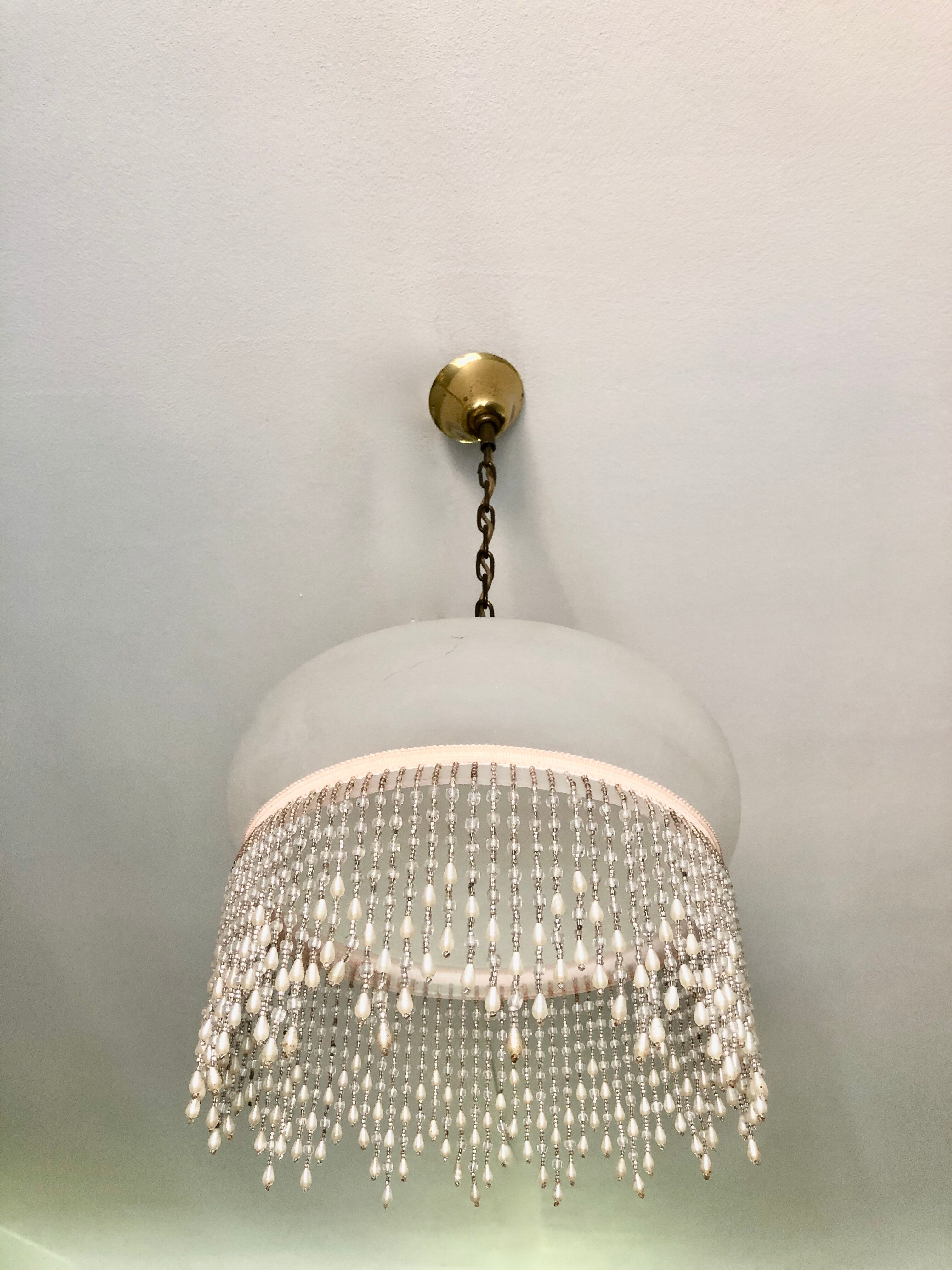 Pink half-shell suspension with pearl fringe