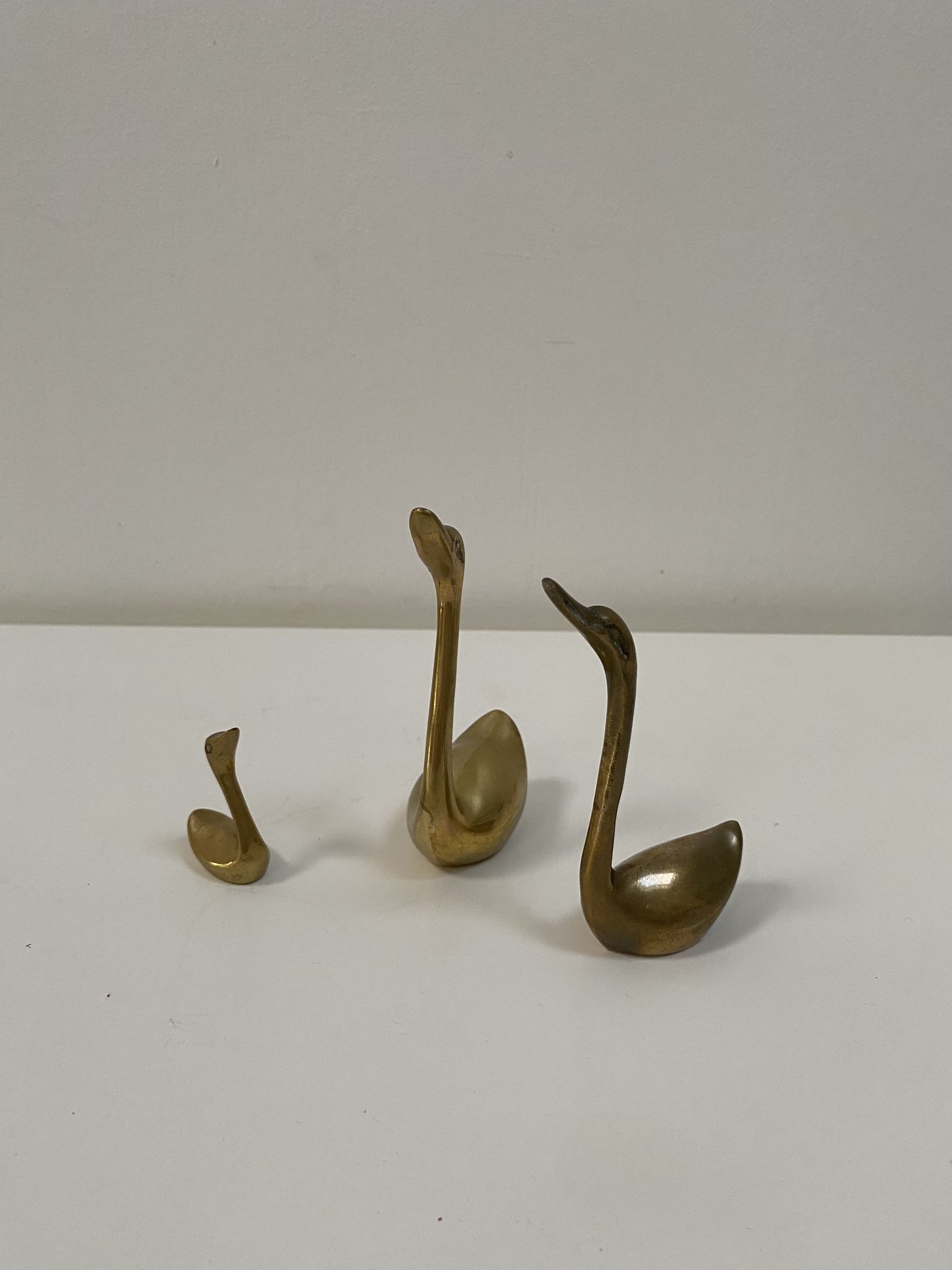 Family of brass swans of the 70s