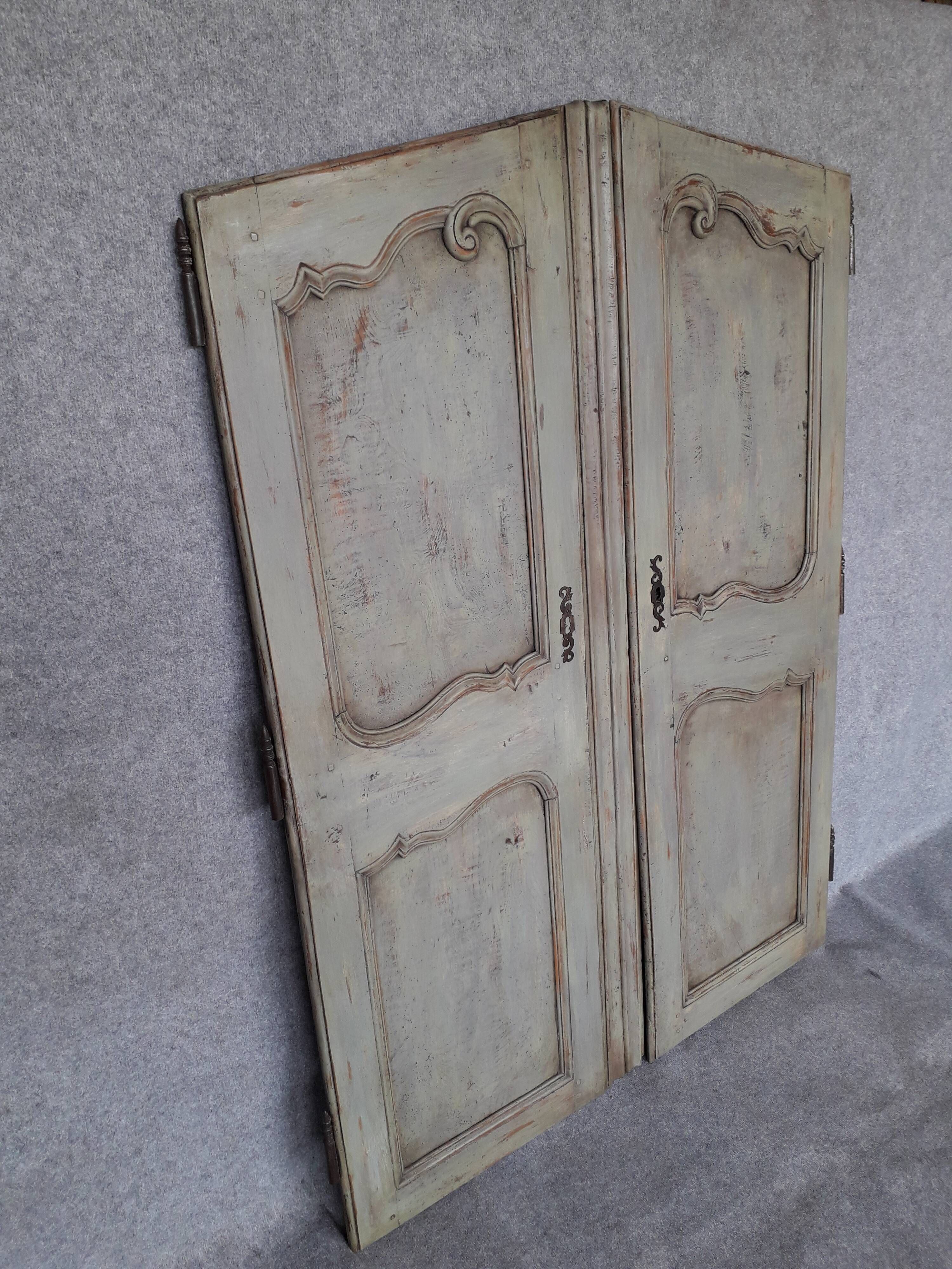 Pair of Louis XV period walnut and ash cabinet doors