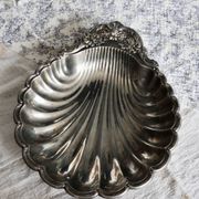 Large vintage shell-shaped platter in shiny silver-plated metal.