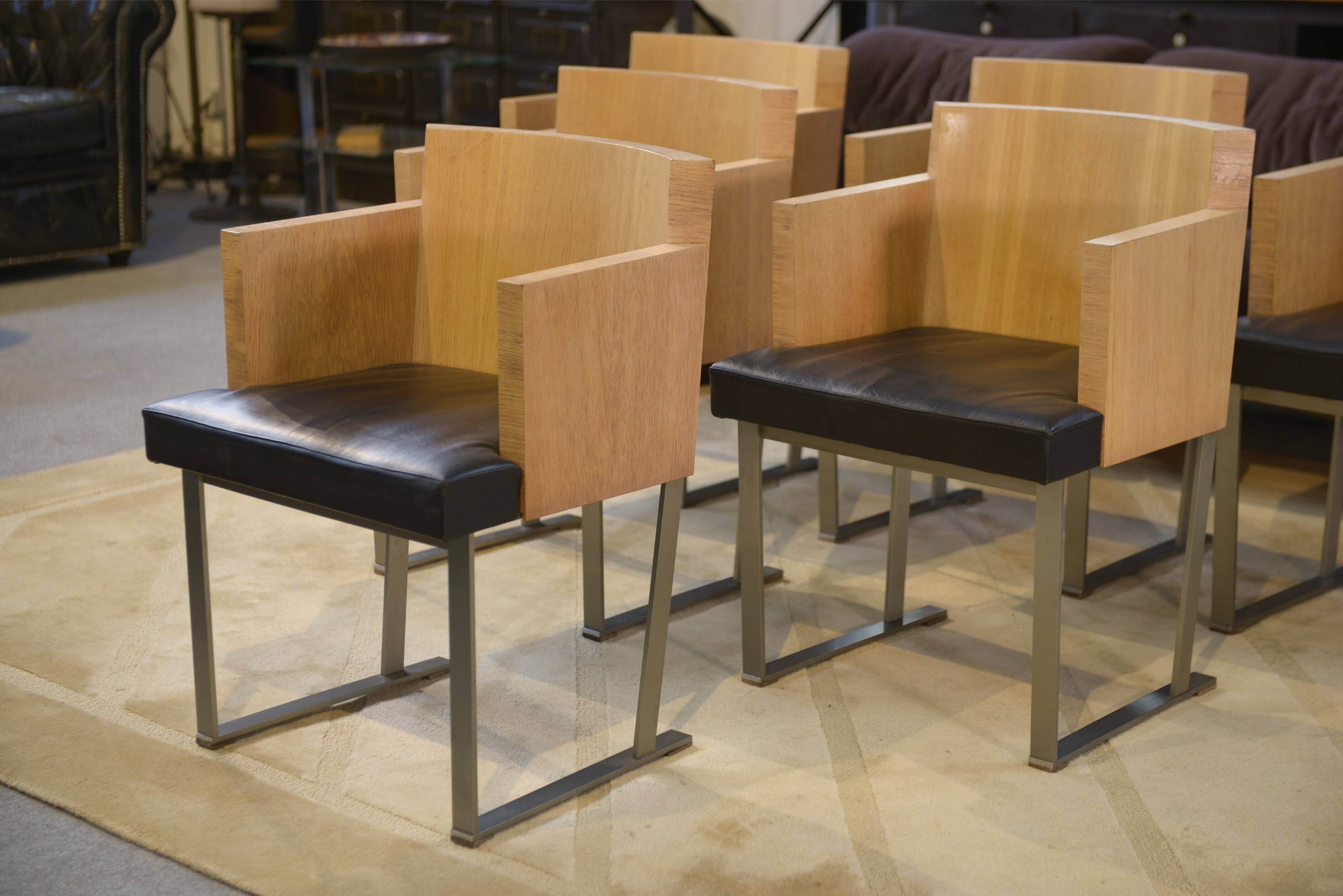 Set of 6 designer armchairs in oak and leather from the 1980s.