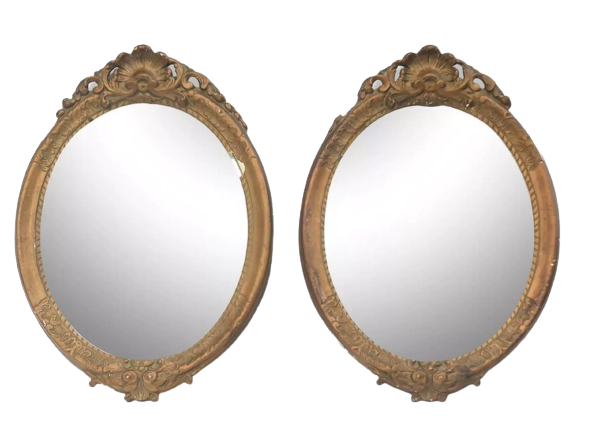 Pair of oval wooden windows with golden patina