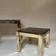 Set of three nesting side tables in brass and smoked mirror.