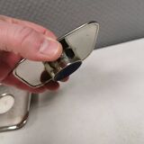 A set of classic Danish candlesticks in polished metal.