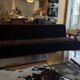 Red Edition Stanley 3-seater sofa with matching chocolate velvet storage.