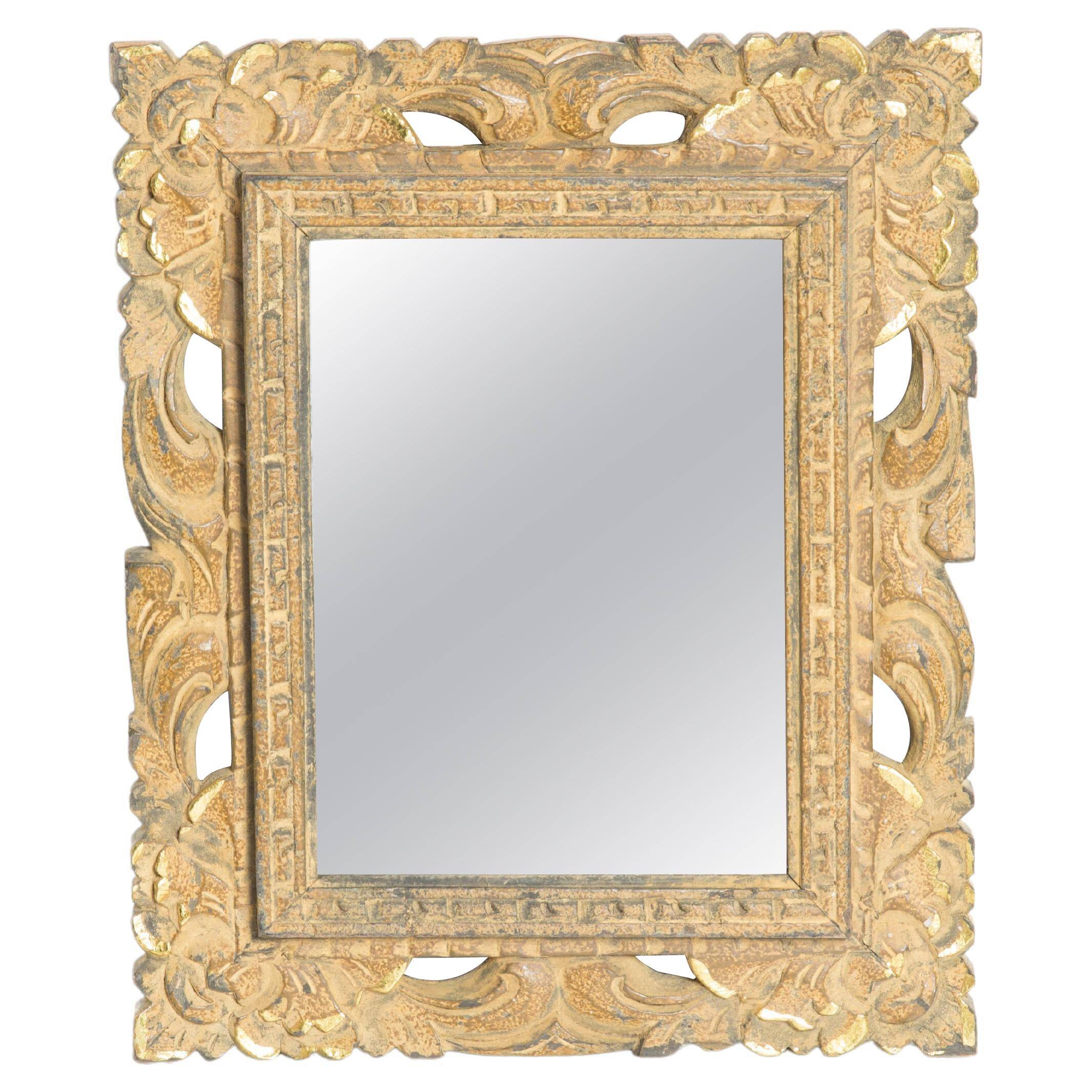 Decorative gold mirror mid-century in a wooden frame, Italy, 1960s.
