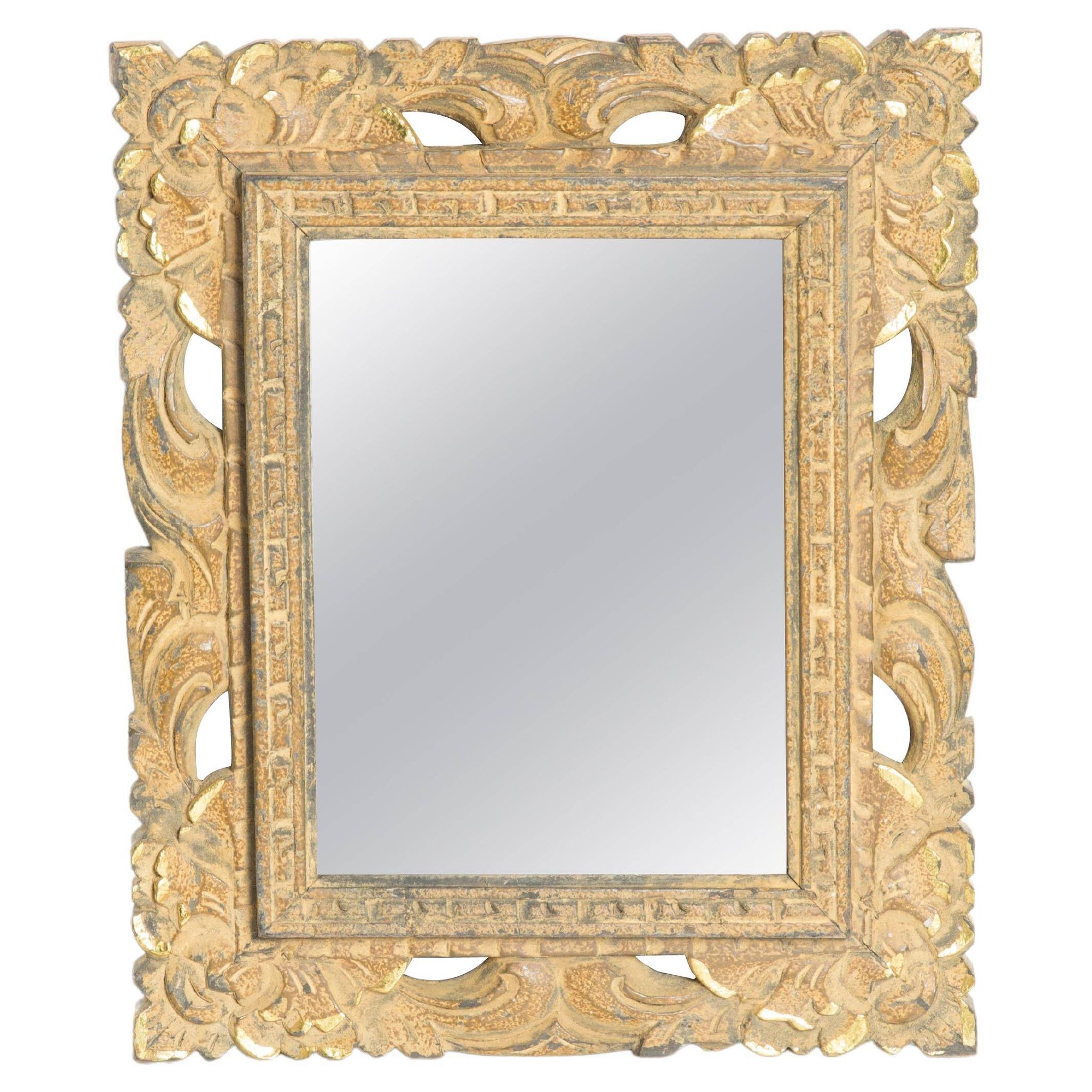 Decorative gold mirror mid-century in a wooden frame, Italy, 1960s.