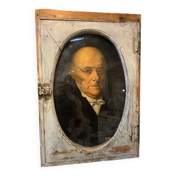 Portrait of the man behind his window.