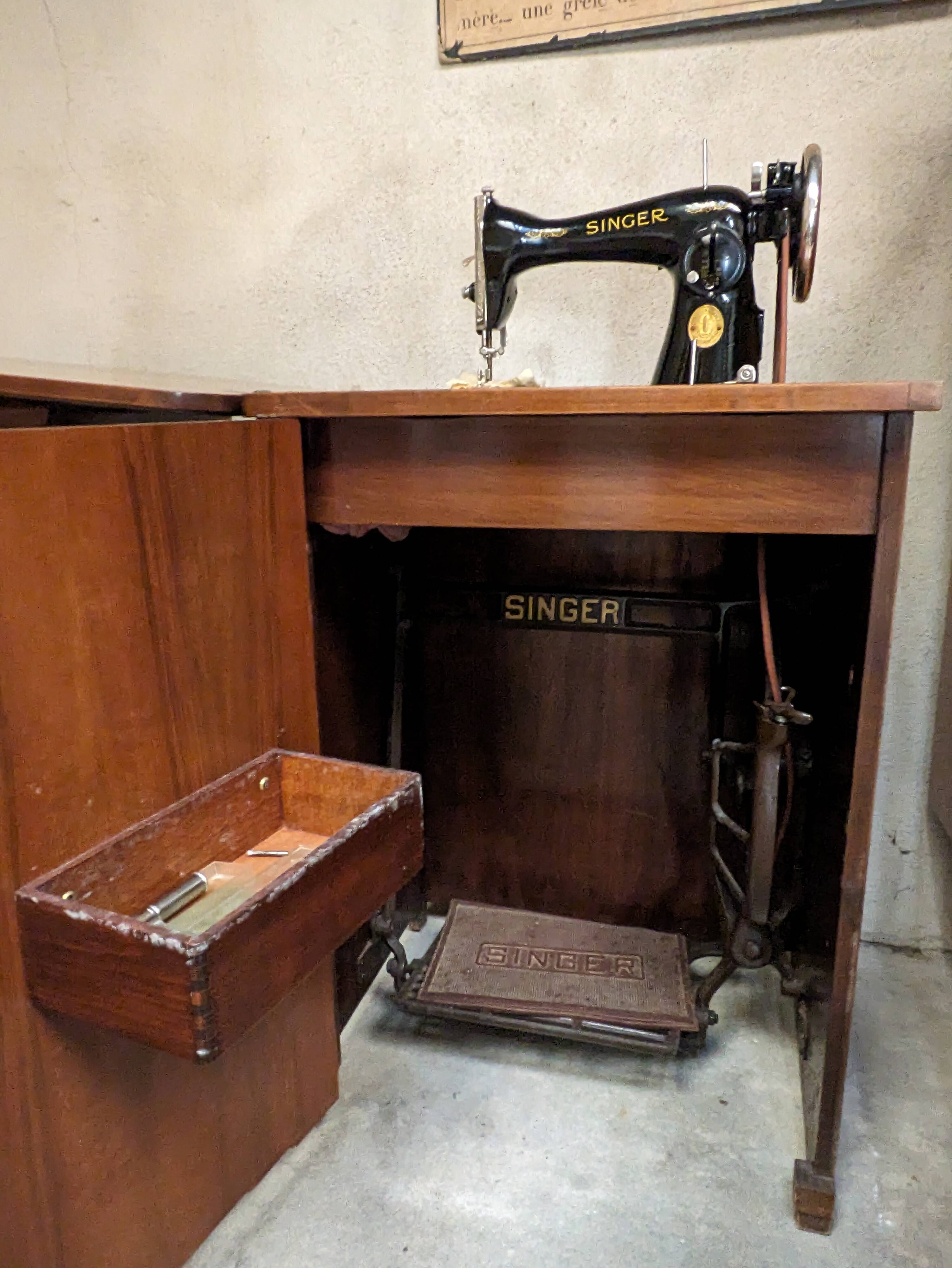 Singer sewing machine in its cabinet