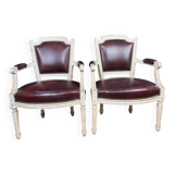 Pair of Louis XVI cabriolet armchairs in lacquered wood and leather circa 1850