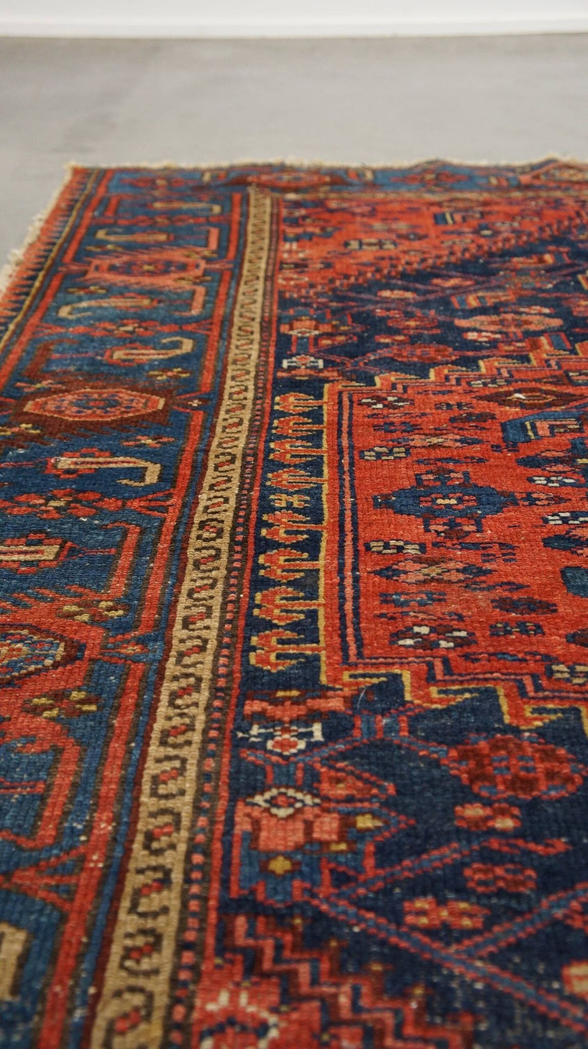 Antique hand-knotted oriental rug with predominantly red, purple, and blue colors 182x136cm