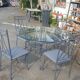 Table ronde et 4 chaises en fer forgé