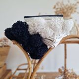 Hand-woven plaid with black stripes and white pompoms