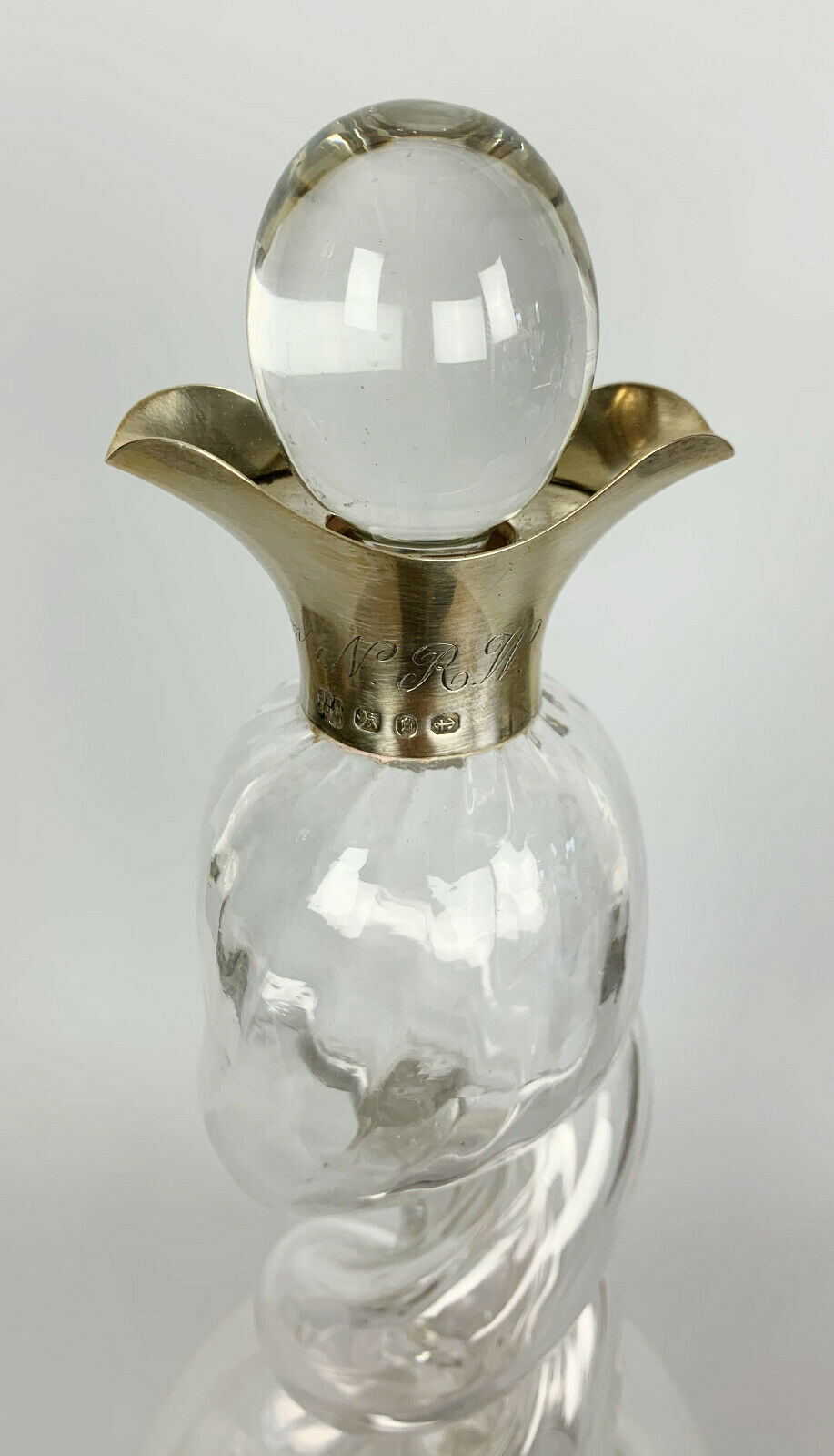 Blown glass carafe with silver frame