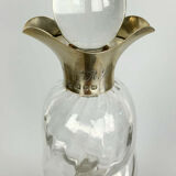 Blown glass carafe with silver frame