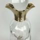 Blown glass carafe with silver frame