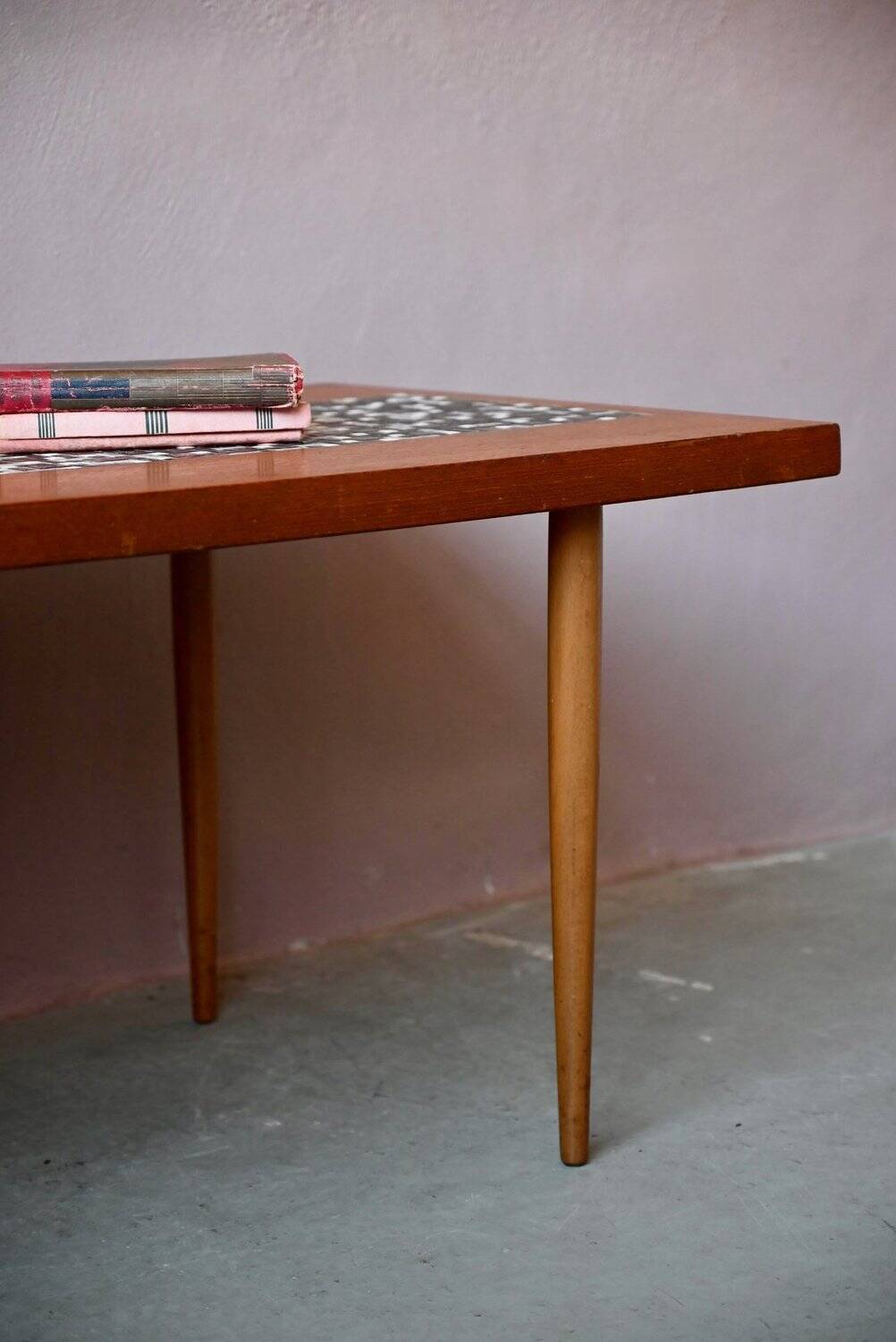 1970s coffee table with a tapered teak base and ceramic mosaic.