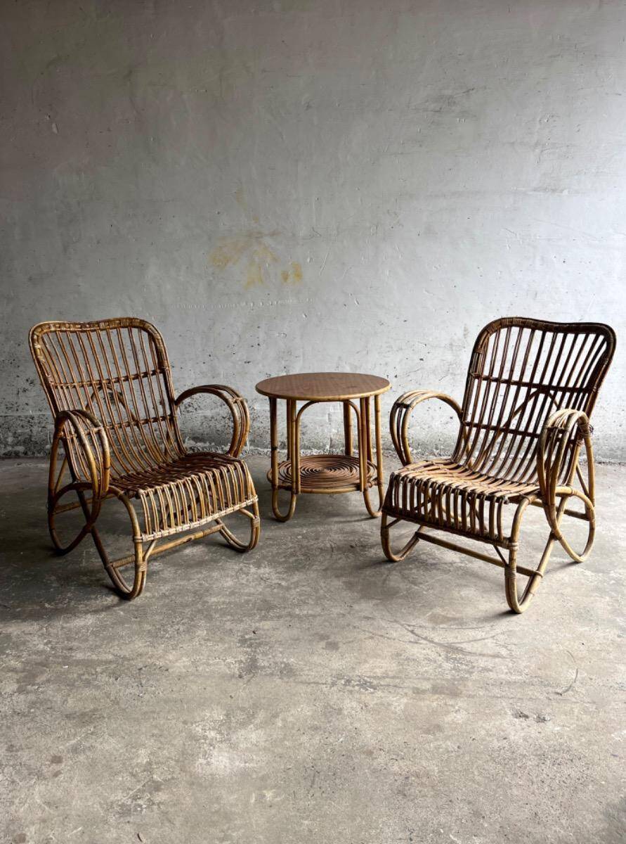 Pair of natural rattan lounge chairs with matching round table — brown mid-century boho set