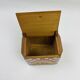 Old wooden salt box with red and white checkerboard decoration