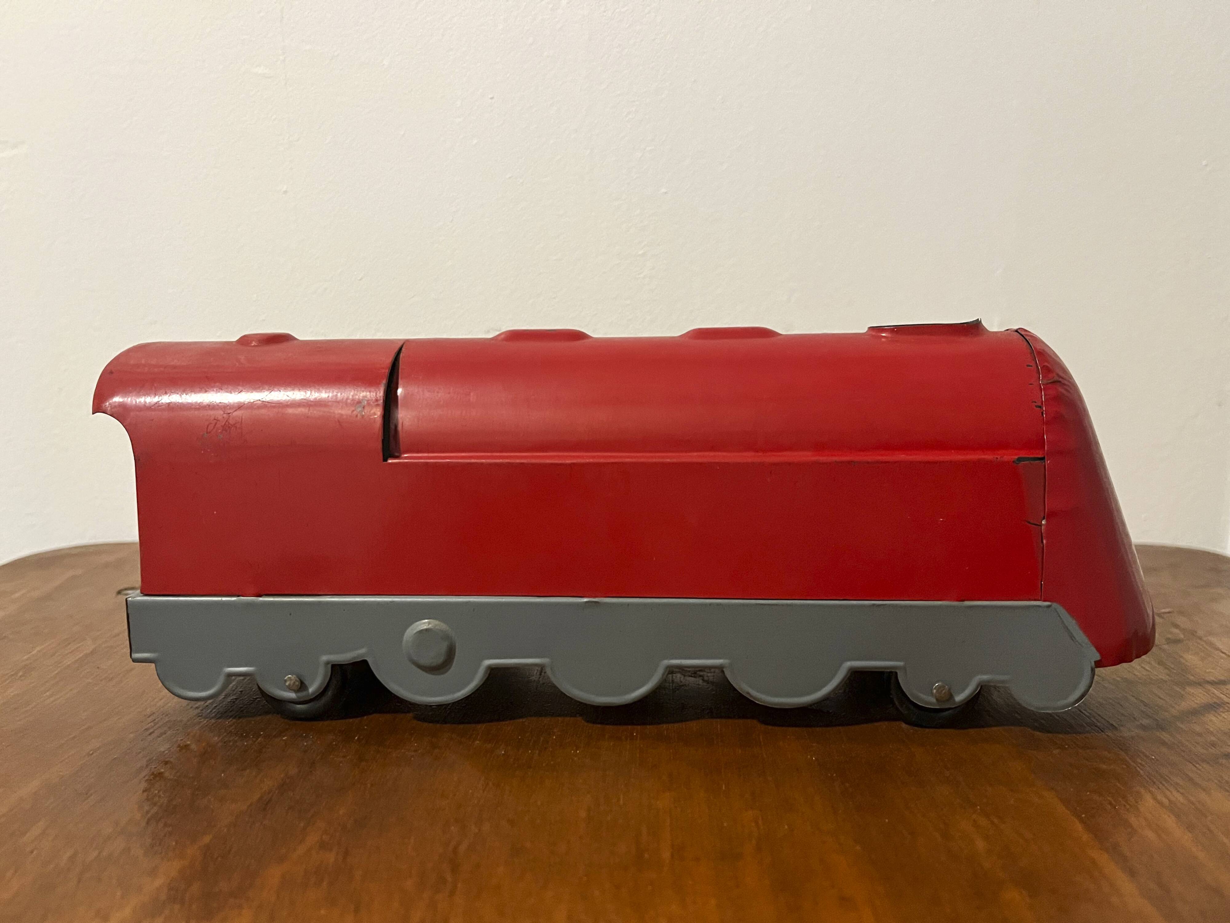 Red sheet metal locomotive 60s