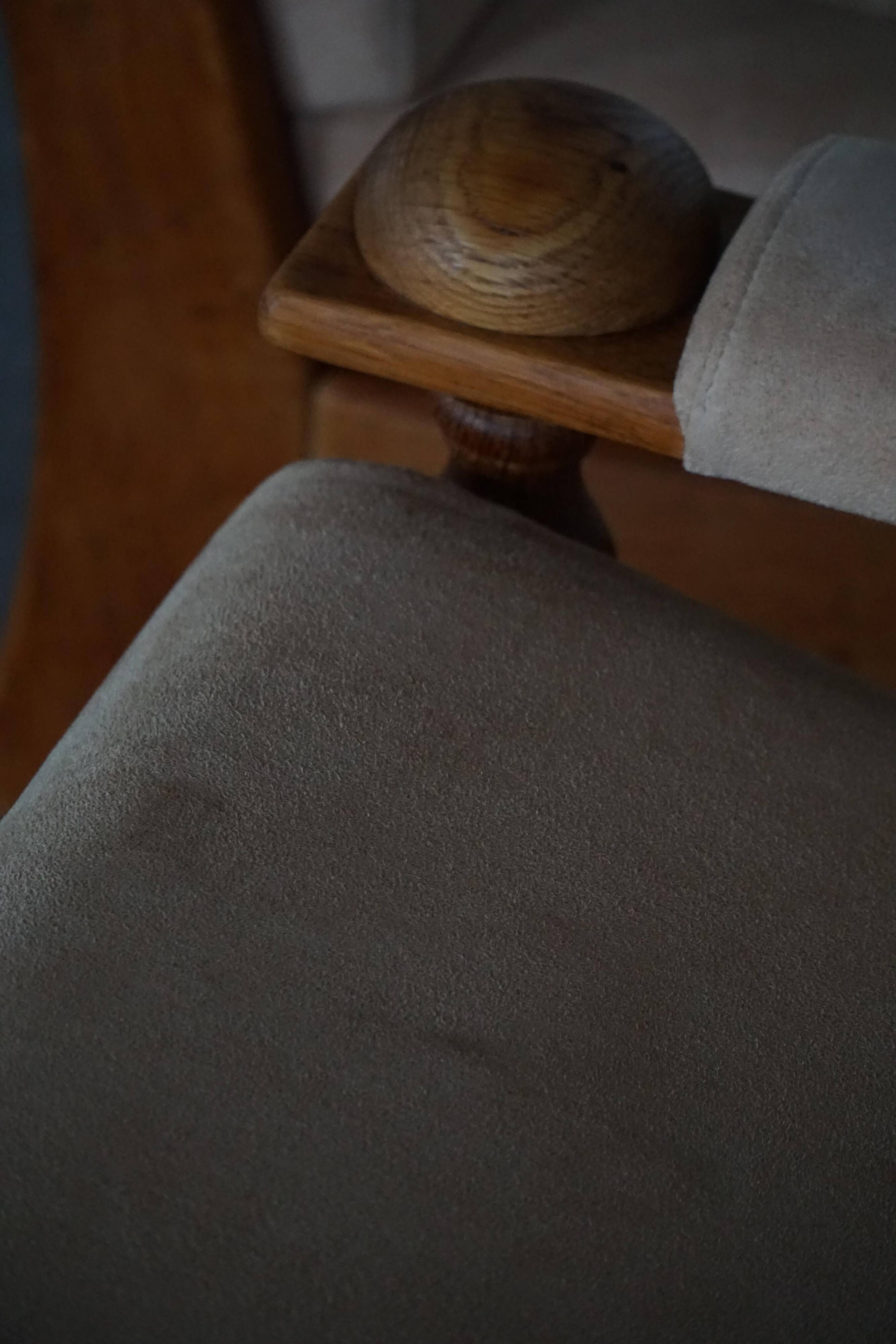 Mid-20th century, pair of armchairs by Henning Kjærnulf, oak and alcantara, 1960s.