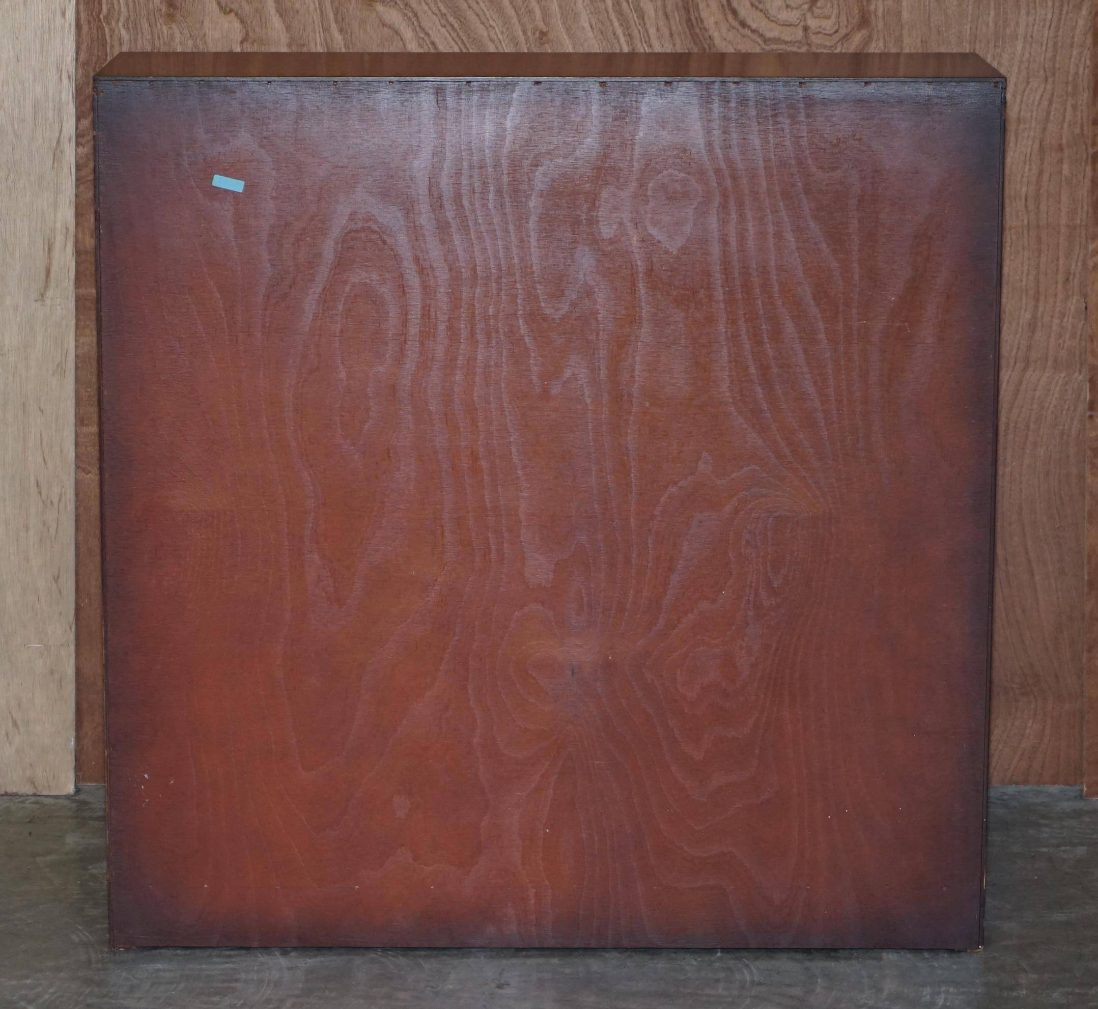 Pair of open dwarf bookshelves in mahogany by Shaws of London.