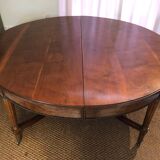 Important central pedestal table in mahogany, brass and bronze that can form a large dining table.