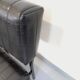 Set of 2 vintage modernist armchairs in black faux leather and metal.
